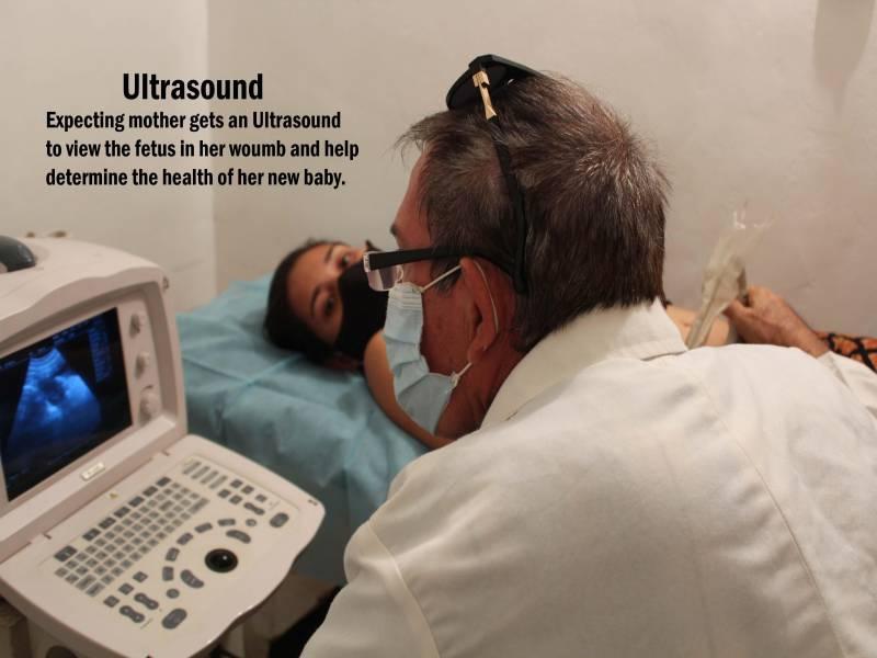 A doctor performs an ultrasound exam on a pregnant woman during a prenatal visit in Venezuela.