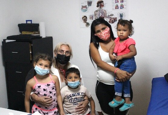 Family Receiving Medical Care – SAI Clinic Venezuela