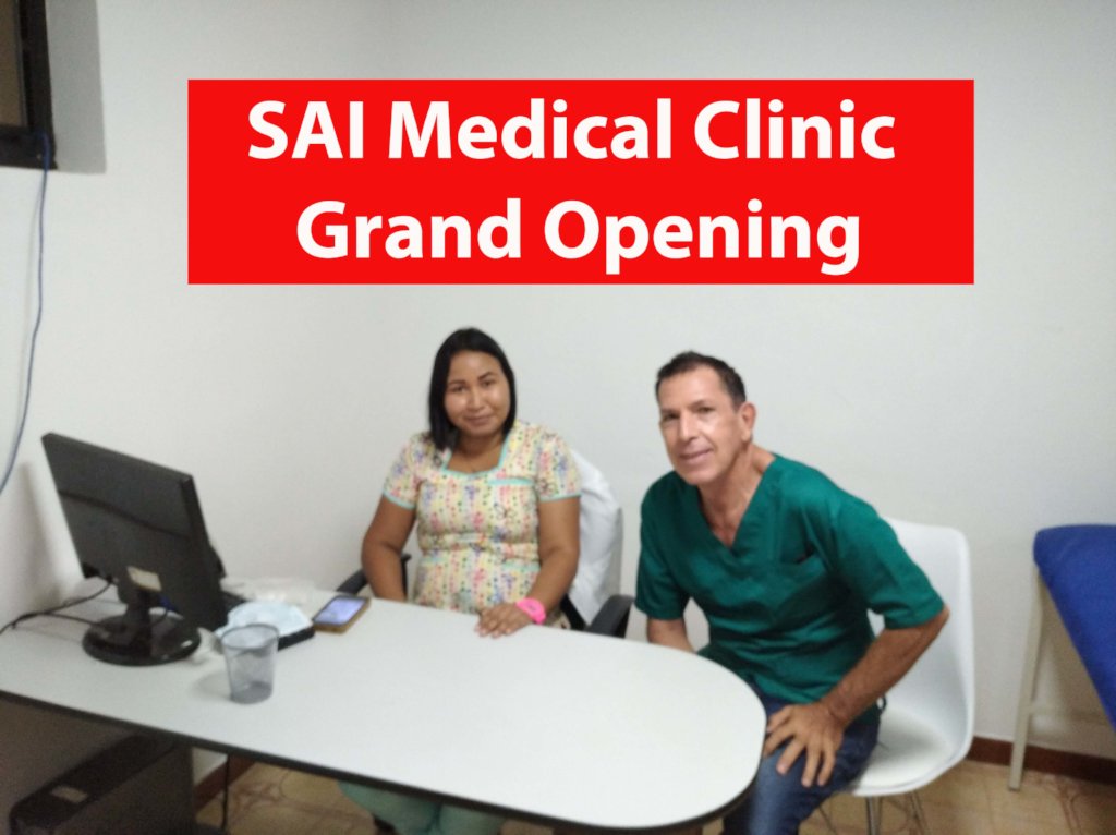 Two staff members sit inside an exam room during the grand opening of SAI Medical Clinic.