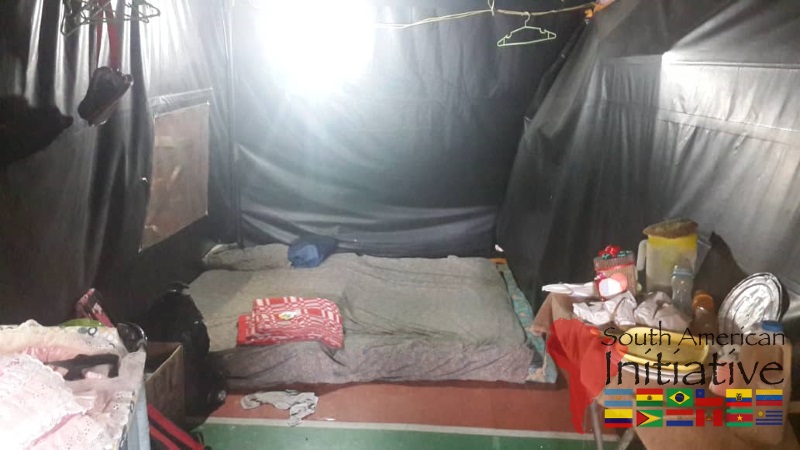 The inside of an emergency shelter with bedding and basic household supplies for displaced families from Venezuela.