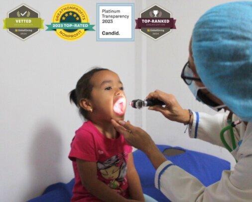 Little Girl Receiving Medical Care by SAI Doctor