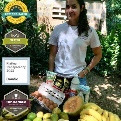 SAI (South American Initiative), a compassionate non-profit in Venezuela, extends its rescue efforts to include endangered zoo animals, ensuring they receive proper nourishment and care. This image captures a volunteer standing behind a table filled with a variety of fresh food supplies, including eggs, papaya, bananas, and packaged goods, carefully selected to meet the dietary needs of rescued wildlife. The setting reflects SAI’s commitment to providing structured nutritional support for zoo animals in need, reinforcing their mission to protect and care for vulnerable species. Through the dedication of volunteers and the generosity of donors, SAI continues to safeguard the health and well-being of endangered animals across Venezuela.